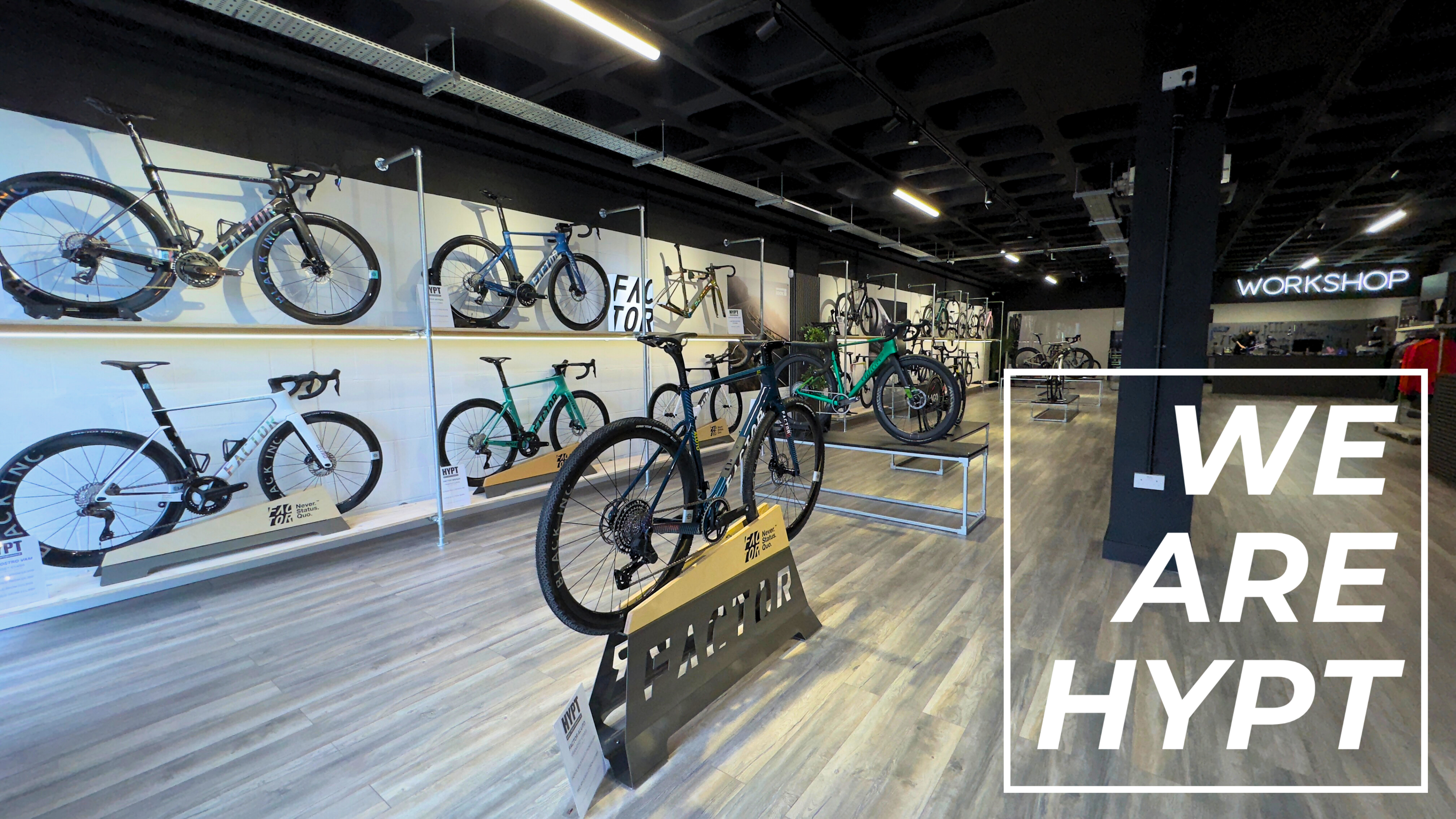 Bicycle store interior with bicycles on display and 'WE ARE HYPT' text overlay.